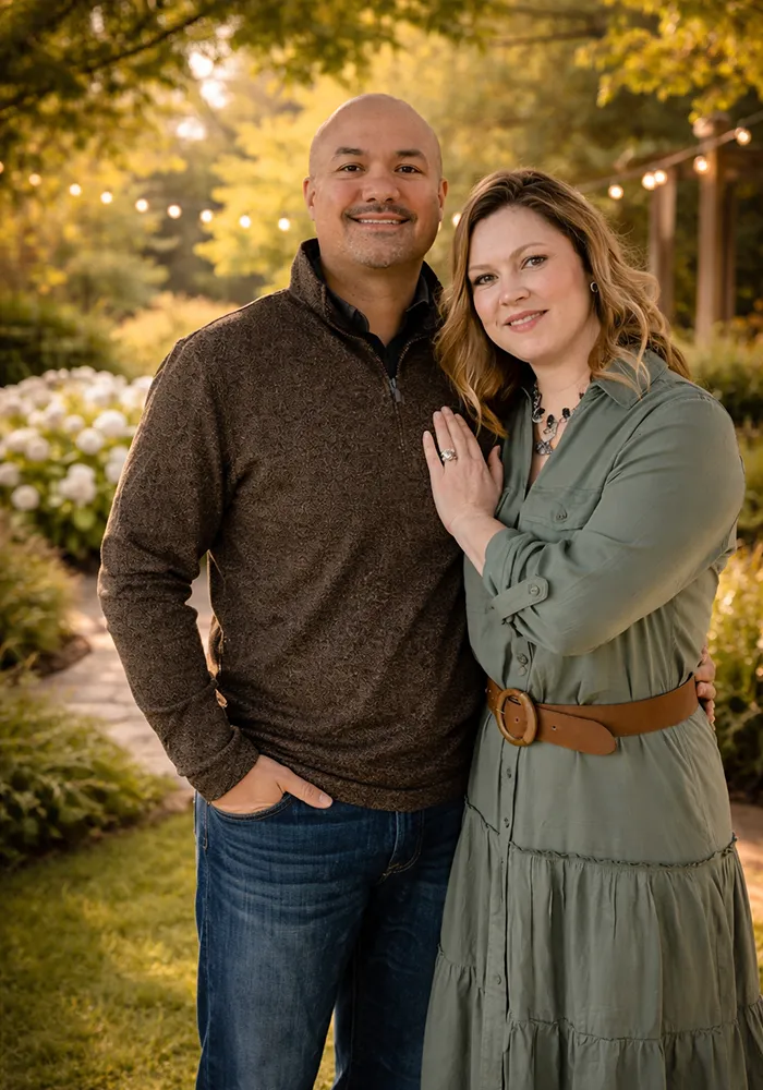Mike and Debralee smiling outside their home